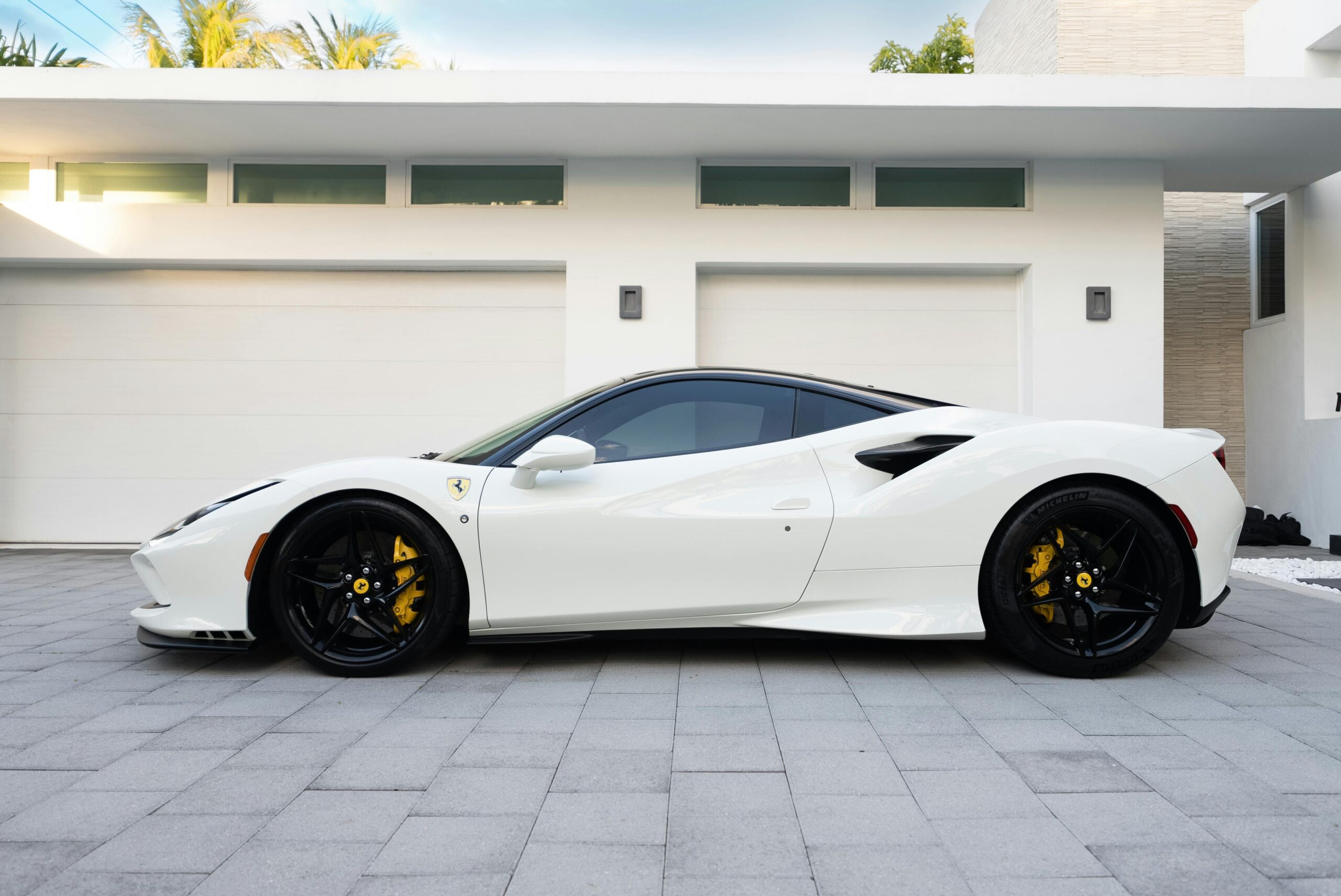 Elegantly parked white Ferrari 488 GTB showcasing luxury and style outdoors.